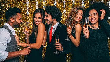 Young people celebrating with glasses of champagne at Argosy Casino Alton.