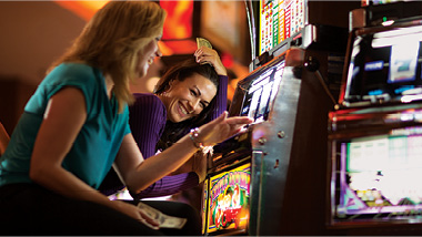 ladies playing slot machines