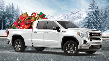 GMC Sierra Pickup Truck with Christmas presents in the back