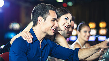 Two young people at a winning slot machine at Argosy Casino Alton.