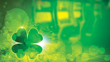 slot machines with clovers on top and green overlay