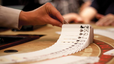 dealer shuffling cards